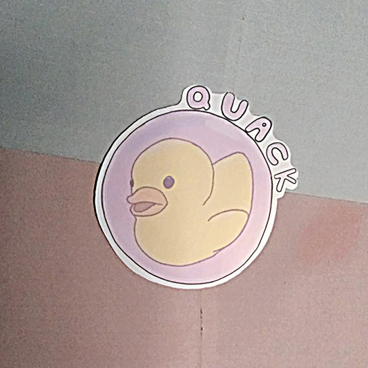 Sticker with an illustration of a duck in a bubble and 'QUACK' text