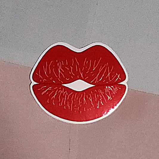 Red pouting lips in kissing design